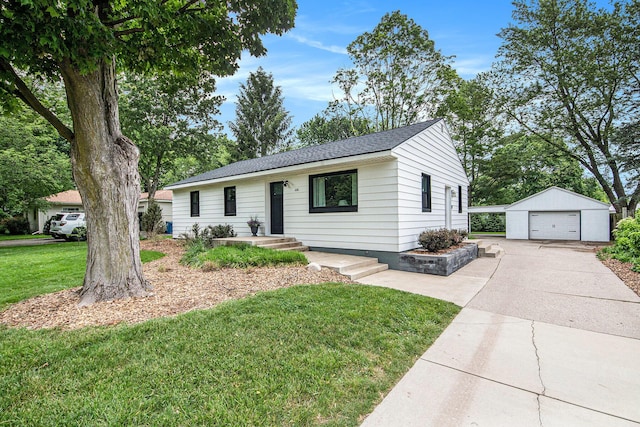 2016 Engleside Dr SE, Grand Rapids, MI 49546 - single story home with a detached garage, concrete driveway, an outdoor structure, a front yard, and a shingled roof