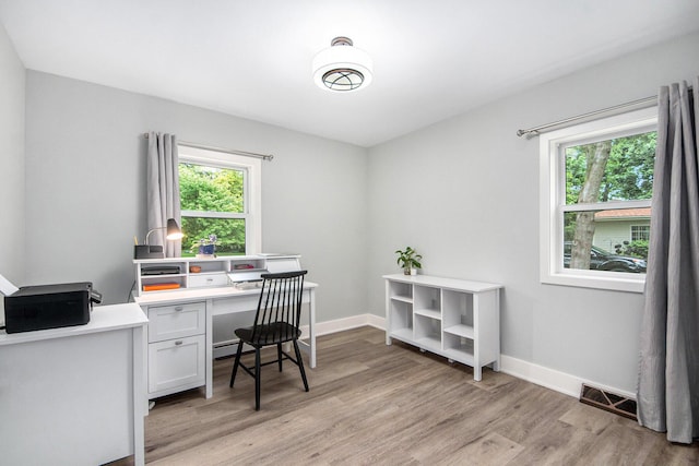 2016 Engleside Dr SE, Grand Rapids, MI 49546 - office area featuring light wood-style flooring, healthy amount of natural light, and baseboards