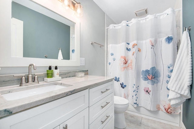 2016 Engleside Dr SE, Grand Rapids, MI 49546 - bathroom with vanity, toilet, and shower / bath combination with curtain