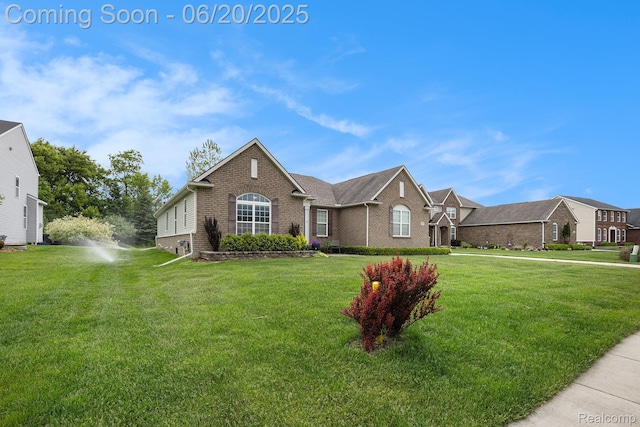 825 Mcintosh Ct, Oakland, MI 48363 - view of front of home featuring brick siding and a front lawn