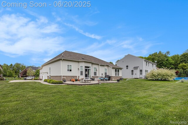 825 Mcintosh Ct, Oakland, MI 48363 - back of property with a yard, a patio area, an attached garage, and roof with shingles