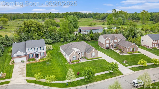 825 Mcintosh Ct, Oakland, MI 48363 - aerial view of property and surrounding area featuring a nearby body of water and a tree filled landscape