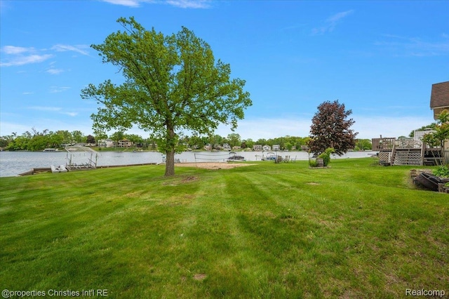 600 Wolverine Dr, Walled Lake, MI 48390 - view of grassy yard featuring a water view and a boat dock