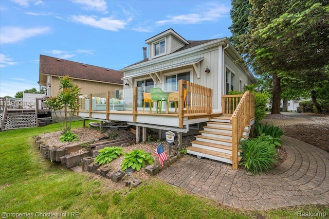 600 Wolverine Dr, Walled Lake, MI 48390 - view of front of property with a deck, stairs, and a front yard