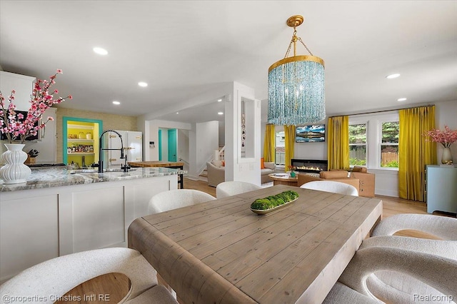 600 Wolverine Dr, Walled Lake, MI 48390 - dining space featuring recessed lighting, stairs, and light wood-style floors