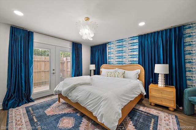 600 Wolverine Dr, Walled Lake, MI 48390 - bedroom featuring access to outside, french doors, a chandelier, wood finished floors, and recessed lighting