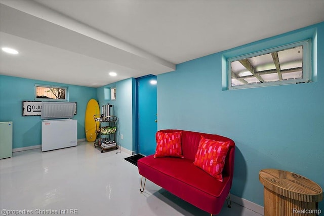 600 Wolverine Dr, Walled Lake, MI 48390 - sitting room with finished concrete flooring, baseboards, and recessed lighting