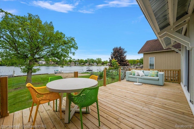 600 Wolverine Dr, Walled Lake, MI 48390 - wooden terrace featuring a water view, a lawn, and outdoor dining space