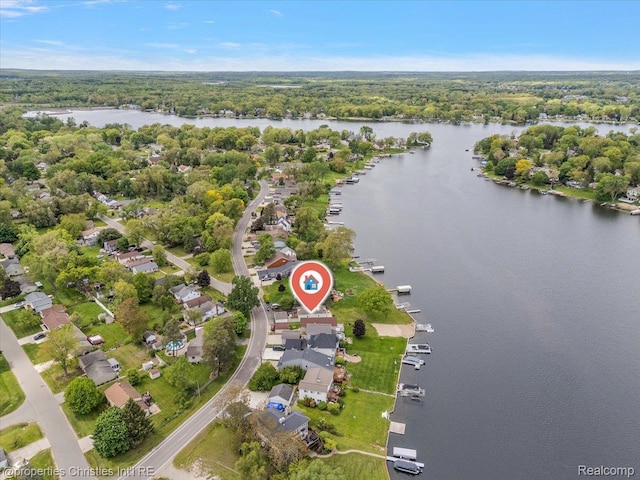 600 Wolverine Dr, Walled Lake, MI 48390 - aerial overview of property's location with a nearby body of water and a heavily wooded area