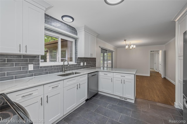 6695 Lahser Rd, Bloomfield Hills, MI 48301 - kitchen featuring stainless steel dishwasher, a peninsula, decorative backsplash, a chandelier, and white cabinets