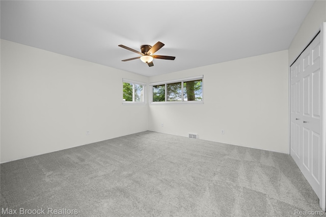 6695 Lahser Rd, Bloomfield Hills, MI 48301 - unfurnished bedroom with carpet, a closet, and a ceiling fan