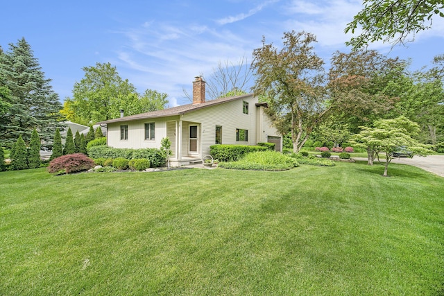 2800 Kimberley Rd, Ann Arbor, MI 48104 - view of front facade with a chimney and a front yard