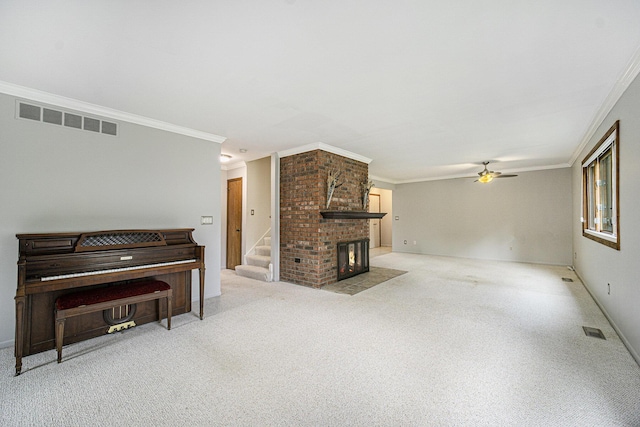 2800 Kimberley Rd, Ann Arbor, MI 48104 - living area featuring a ceiling fan, crown molding, stairs, a brick fireplace, and light carpet