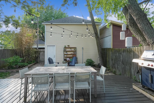 1118 Main St, Saint Joseph, MI 49085 - deck featuring a fenced backyard, outdoor dining space, and a grill