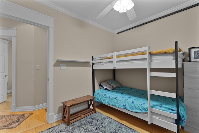 1118 Main St, Saint Joseph, MI 49085 - bedroom featuring wood finished floors, ornamental molding, baseboards, and a ceiling fan