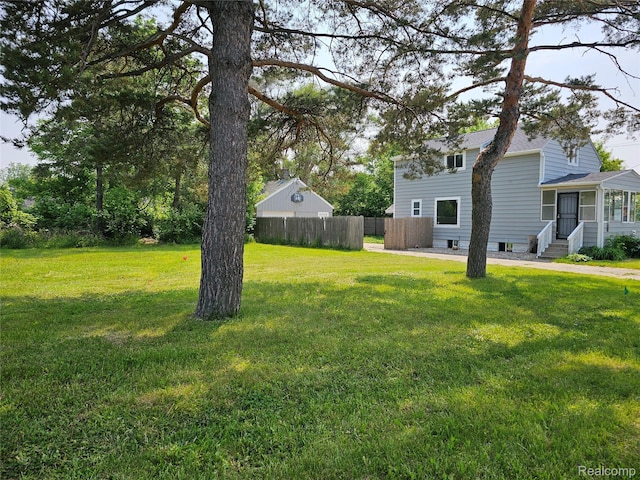 1073 W Bristol Rd, Grand Blanc, MI 48507 - view of yard with entry steps and a sunroom