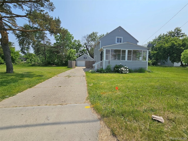 1073 W Bristol Rd, Grand Blanc, MI 48507 - bungalow-style house with driveway, an outdoor structure, a detached garage, and a front yard