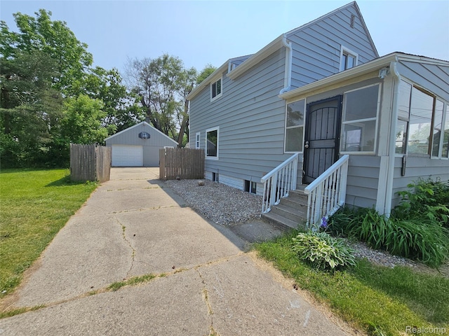 1073 W Bristol Rd, Grand Blanc, MI 48507 - view of property exterior with concrete driveway, a garage, and an outdoor structure