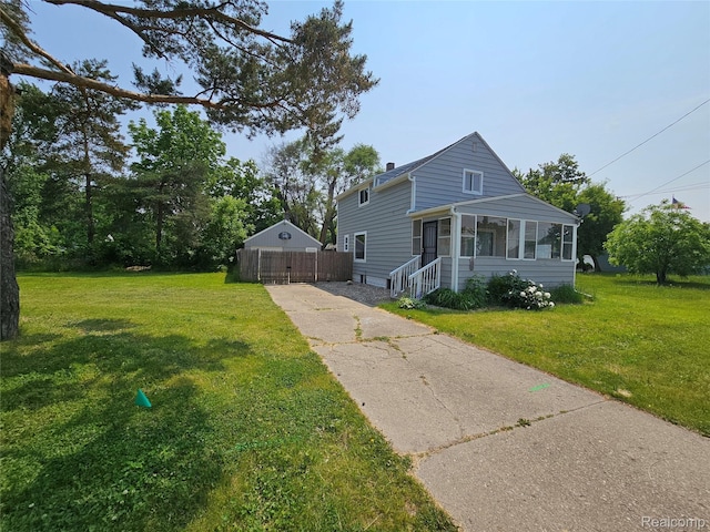1073 W Bristol Rd, Grand Blanc, MI 48507 - view of front facade featuring concrete driveway and a chimney