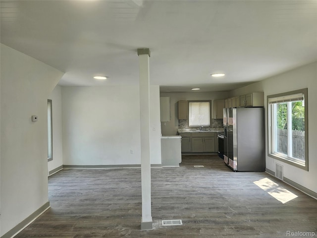 1073 W Bristol Rd, Grand Blanc, MI 48507 - kitchen with freestanding refrigerator, backsplash, dark wood-style flooring, gray cabinetry, and light countertops