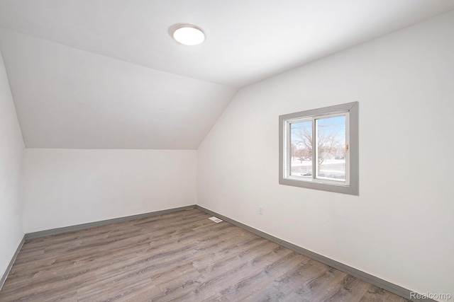 1073 W Bristol Rd, Grand Blanc, MI 48507 - bonus room with lofted ceiling and wood finished floors