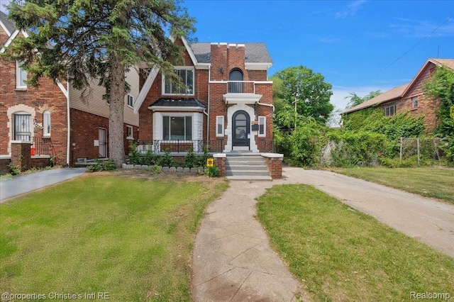 17155 Wisconsin St, Detroit, MI 48221 - view of front of house featuring a front yard and brick siding