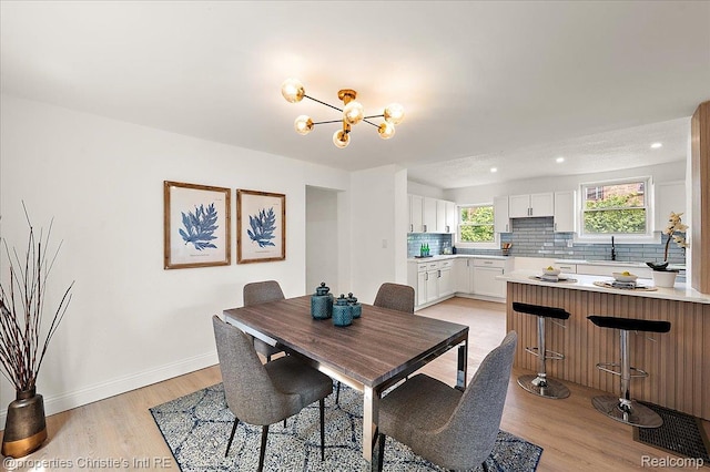 17155 Wisconsin St, Detroit, MI 48221 - dining space featuring light wood-style floors, a chandelier, baseboards, and recessed lighting