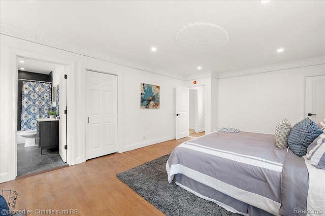 17155 Wisconsin St, Detroit, MI 48221 - bedroom featuring wood finished floors, recessed lighting, baseboards, crown molding, and ensuite bathroom