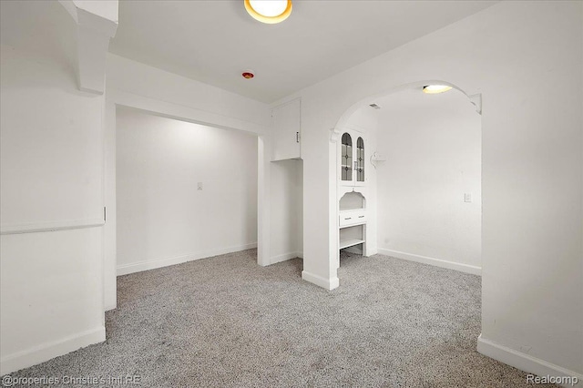 17155 Wisconsin St, Detroit, MI 48221 - unfurnished bedroom with arched walkways, carpet floors, and baseboards