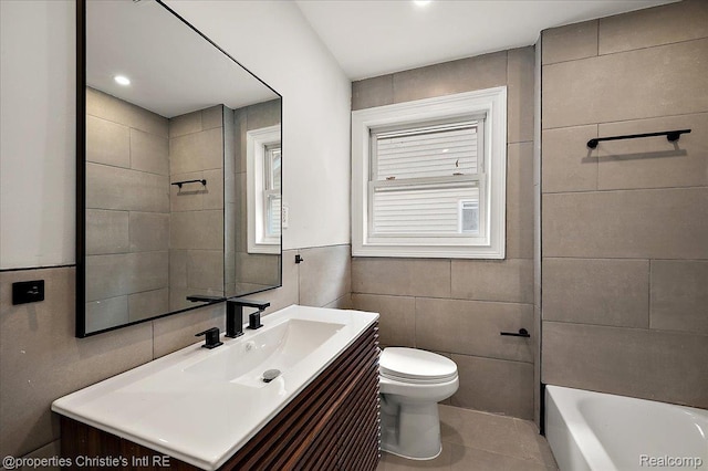 17155 Wisconsin St, Detroit, MI 48221 - bathroom featuring toilet, vanity, tile walls, and tile patterned floors