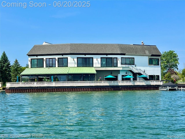 1869 Union Lake Rd, Commerce Twp, MI 48382 - rear view of house with a water view and stairway