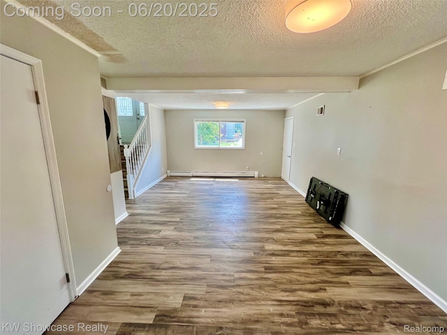 1869 Union Lake Rd, Commerce Twp, MI 48382 - unfurnished living room featuring a baseboard radiator, wood finished floors, a textured ceiling, and stairway