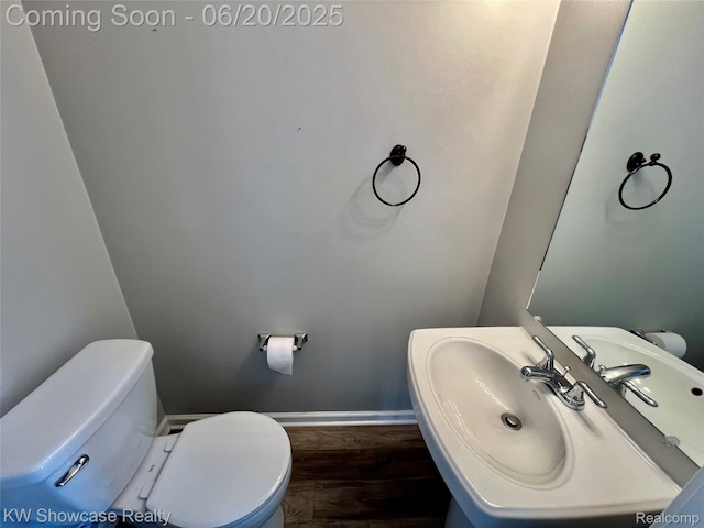 1869 Union Lake Rd, Commerce Twp, MI 48382 - bathroom featuring wood finished floors and toilet