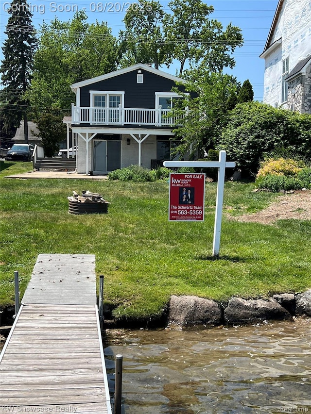 1869 Union Lake Rd, Commerce Twp, MI 48382 - dock area with a yard and a deck