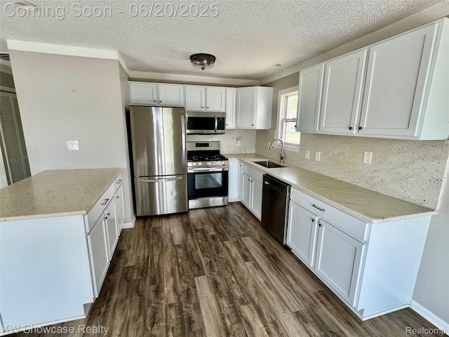 1869 Union Lake Rd, Commerce Twp, MI 48382 - kitchen featuring appliances with stainless steel finishes, dark wood finished floors, a peninsula, white cabinets, and a textured ceiling
