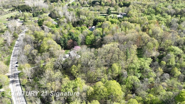 8285 Seymour Rd, Flushing, MI 48433 - aerial view of property's location with a heavily wooded area