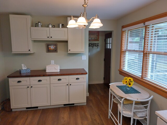 70170 Ironwood Dr, Niles, MI 49120 - kitchen with dark wood-type flooring, white cabinets, decorative light fixtures, and a chandelier