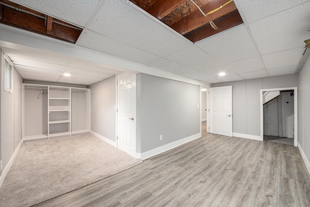 455 N 10th St, Plainwell, MI 49080 - finished below grade area featuring a paneled ceiling, wood finished floors, baseboards, and recessed lighting