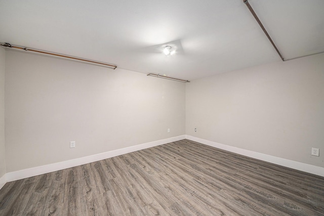 455 N 10th St, Plainwell, MI 49080 - empty room featuring wood finished floors and baseboards