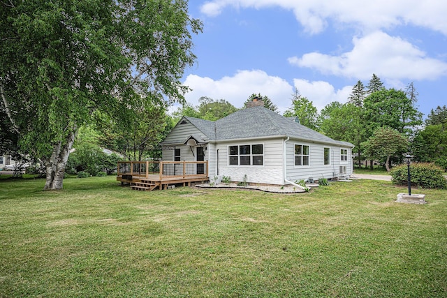 455 N 10th St, Plainwell, MI 49080 - rear view of property with a chimney, a wooden deck, a yard, and roof with shingles