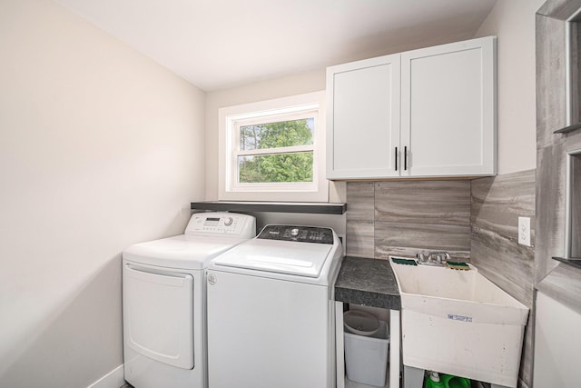 455 N 10th St, Plainwell, MI 49080 - laundry room with cabinet space, washing machine and dryer, and baseboards