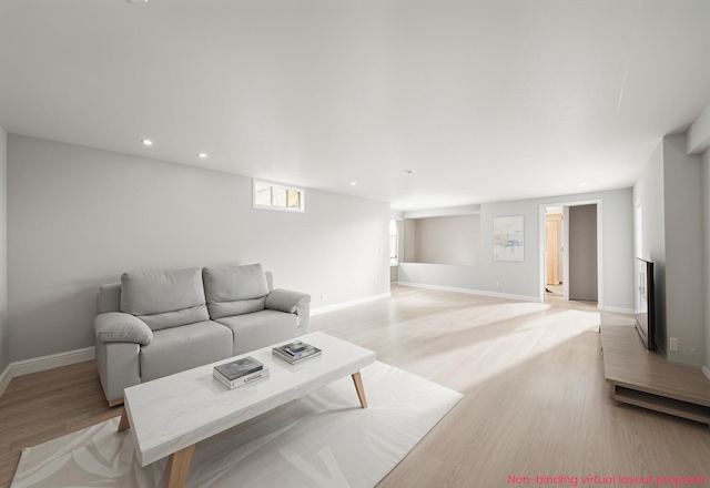 455 N 10th St, Plainwell, MI 49080 - living area with light wood-style floors, baseboards, and recessed lighting