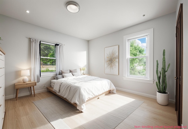 455 N 10th St, Plainwell, MI 49080 - bedroom with multiple windows, light wood-style floors, baseboards, and recessed lighting