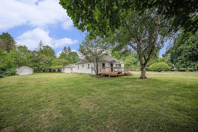 455 N 10th St, Plainwell, MI 49080 - view of green lawn with a deck and a garage