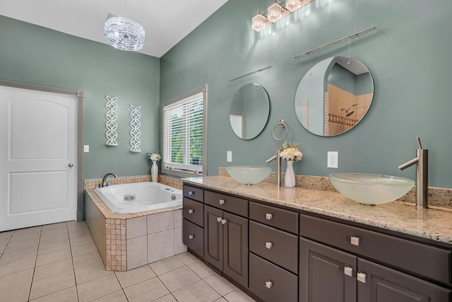 7910 Stony Lake Rd, Jackson, MI 49201 - full bath with double vanity, a bath, and tile patterned floors