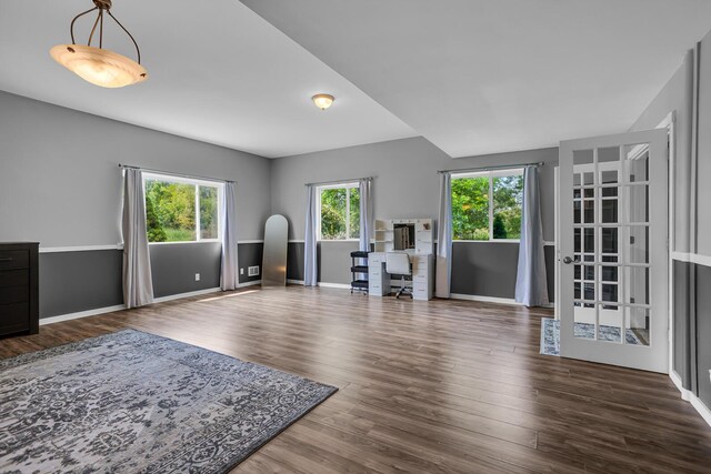 7910 Stony Lake Rd, Jackson, MI 49201 - unfurnished living room with wood finished floors, a desk, and baseboards