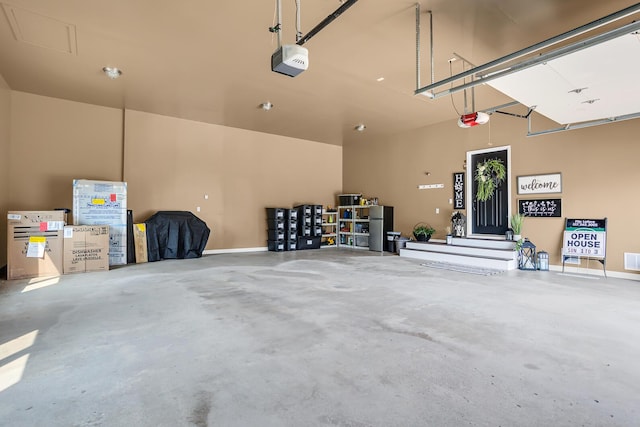 7910 Stony Lake Rd, Jackson, MI 49201 - garage with a garage door opener and baseboards