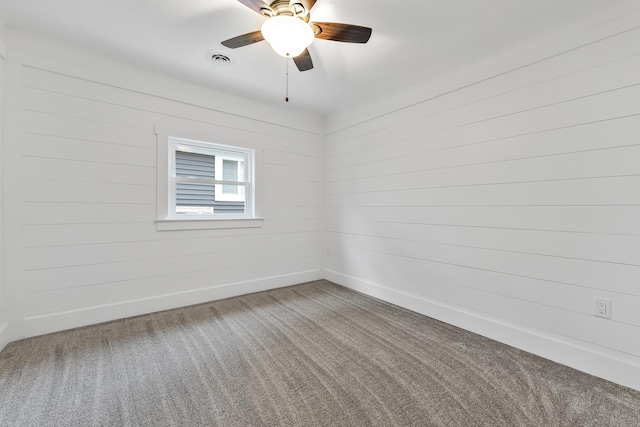 3551 W W Lake Mitchell Dr, Cadillac, MI 49601 - carpeted spare room with a ceiling fan and baseboards