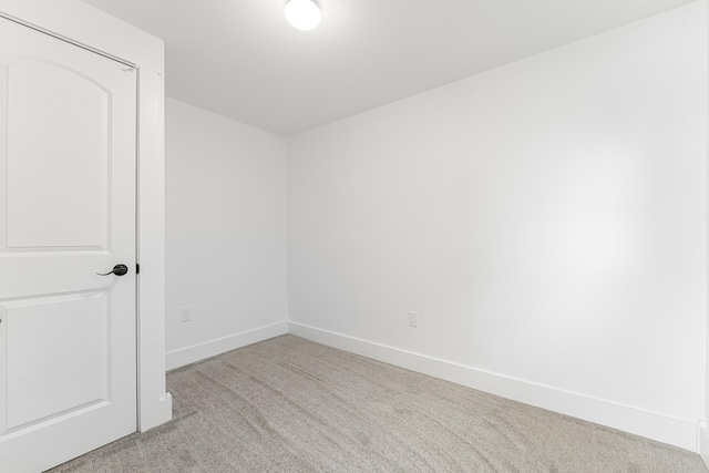 3551 W W Lake Mitchell Dr, Cadillac, MI 49601 - unfurnished room featuring carpet floors and baseboards