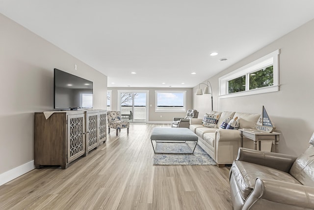 3551 W W Lake Mitchell Dr, Cadillac, MI 49601 - living area with light wood-type flooring, healthy amount of natural light, and recessed lighting